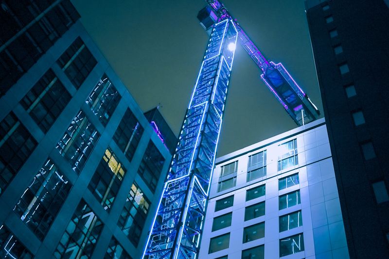 Crane and tower at night